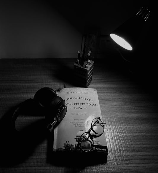 a pair of glasses sitting on top of a book